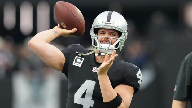 Las Vegas Raiders quarterback Derek Carr (4) warms up before a game against the New England Patriots at Allegiant Stadium.